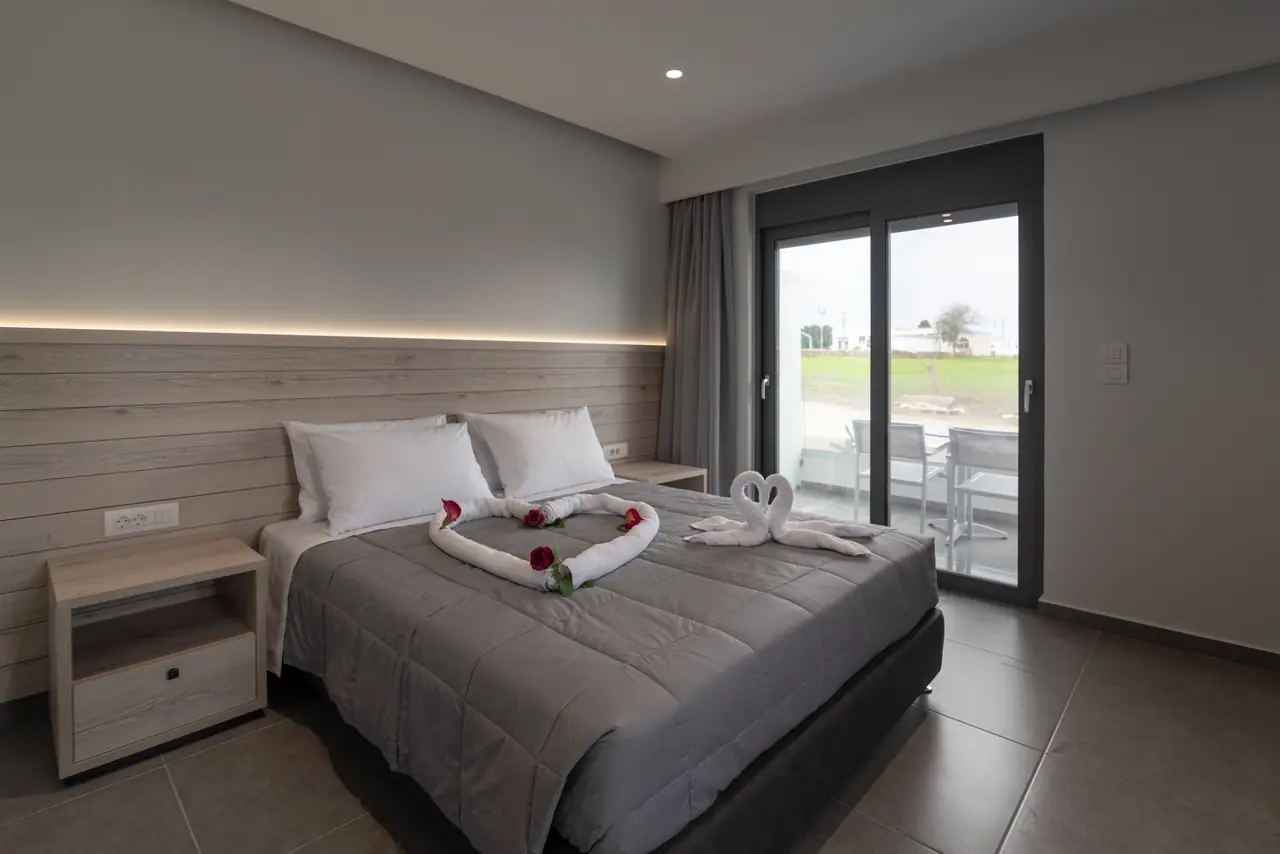 Bedroom with roses and towel art