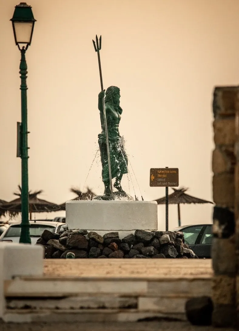 The bronze Poseidon statue and fountain by Mastichari harbour